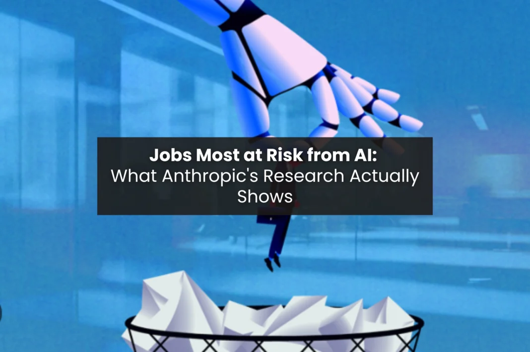 Robotic hand dropping crumpled paper into a bin, representing jobs most at risk from AI automation according to Anthropic research